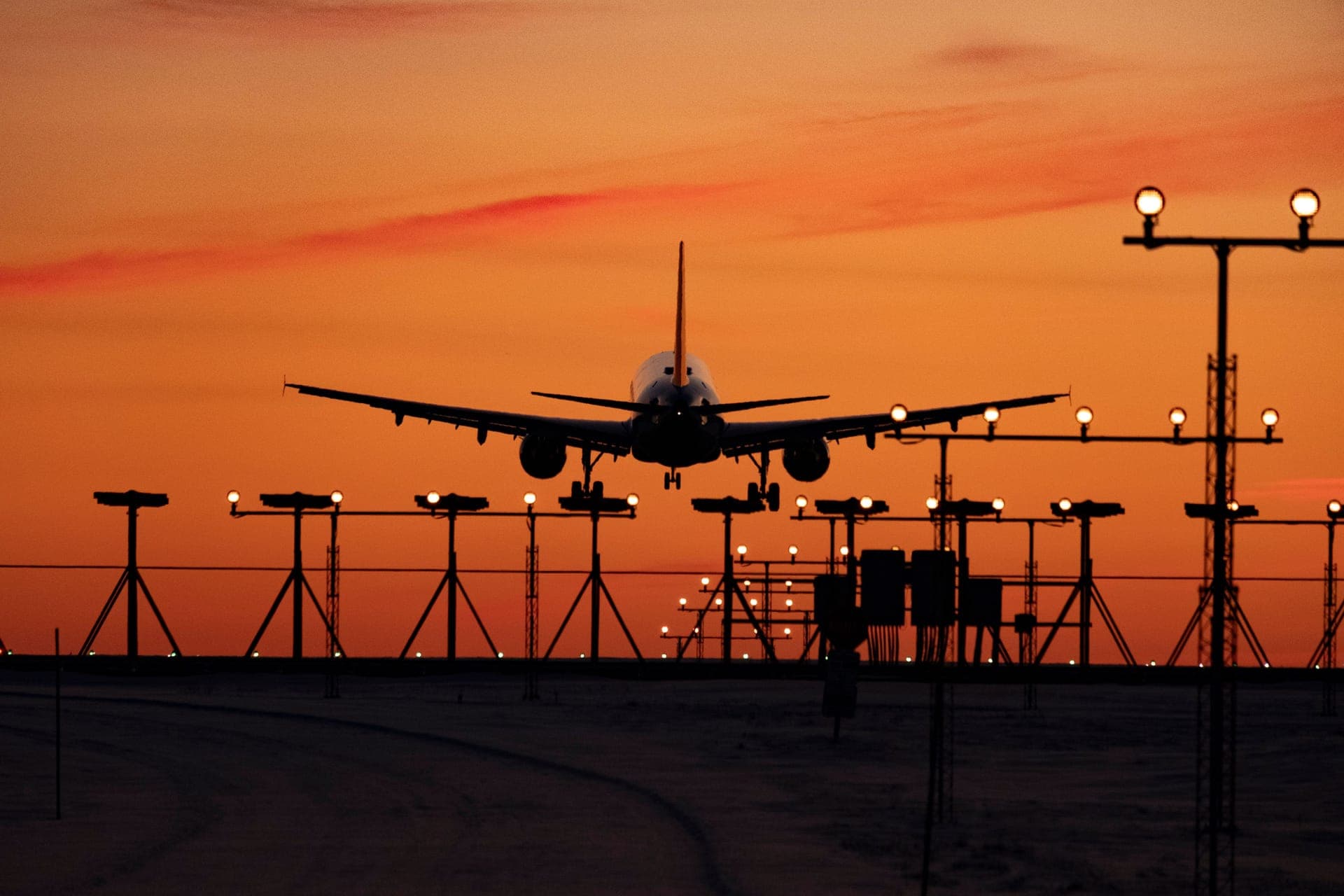 A runway stretching toward the horizon at dusk
